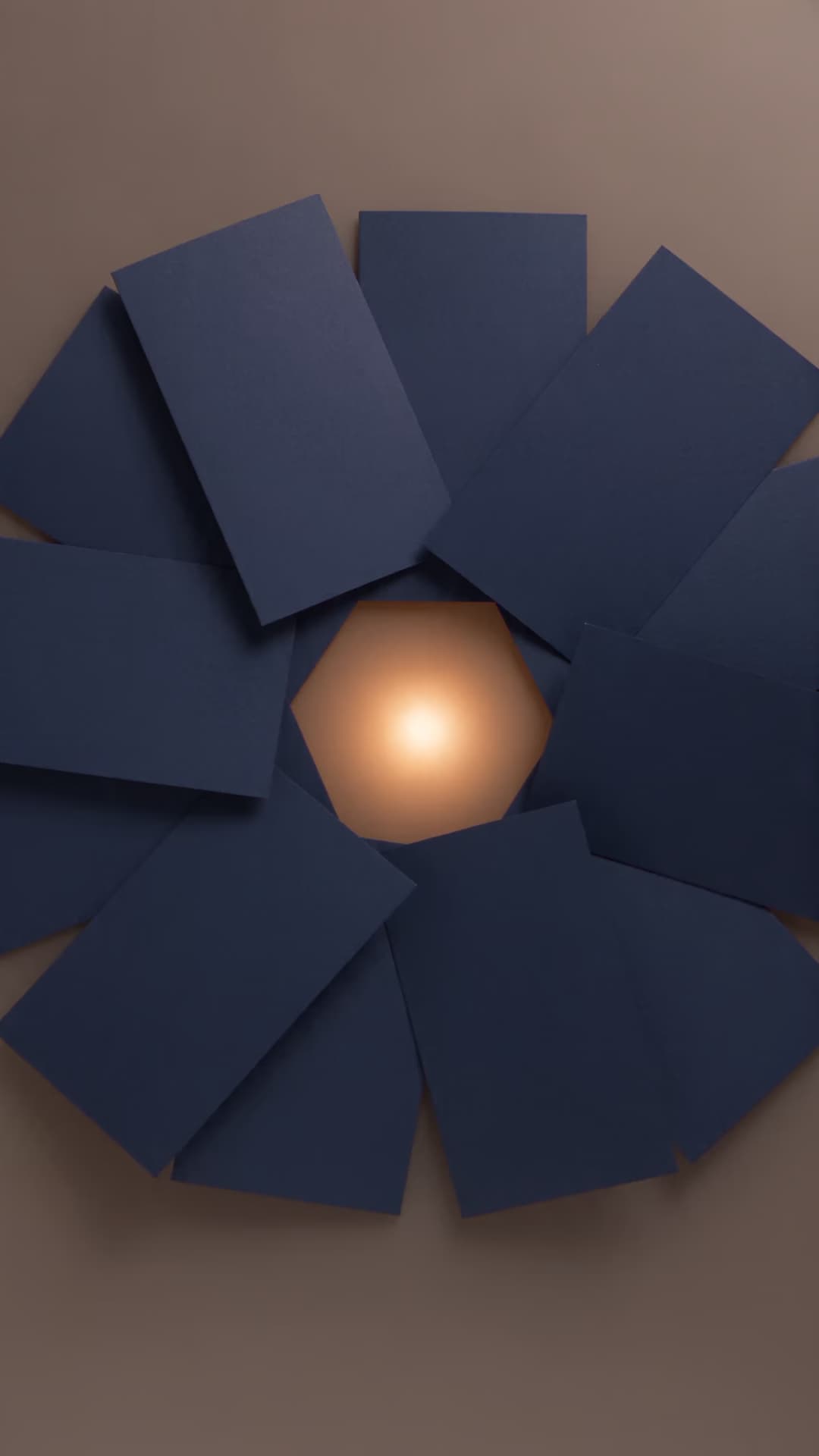 Eight blue paper tiles around a warm candle reflection.
